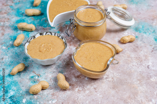 Homemade peanut butter in a jar and bowl.
