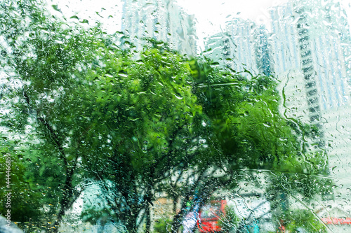 Raindrops on the window with street view background