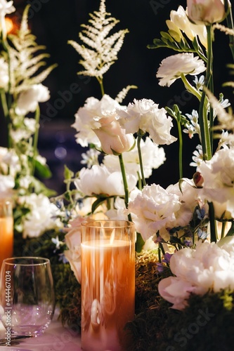 Romantic Wedding Table Top Layout Decor with large lush floral bouquets including white roses, ranunculus, persian buttercups, white orchids and candles