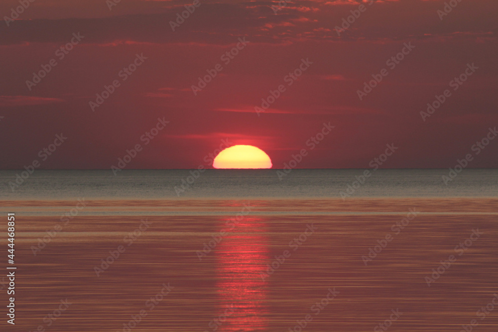 Evening sun over the tropical sea with waves. Nature background