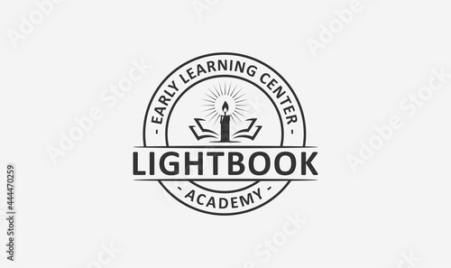 education academy logo design with the candle and book element.