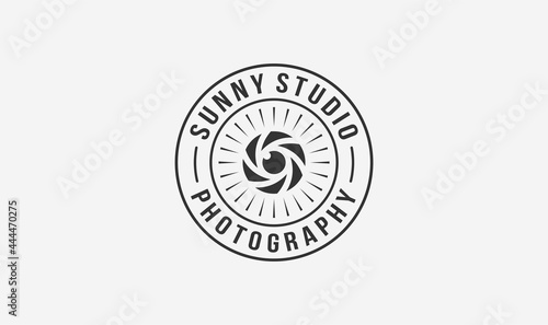 studio photographer stamp logo design with the sun and lens element.