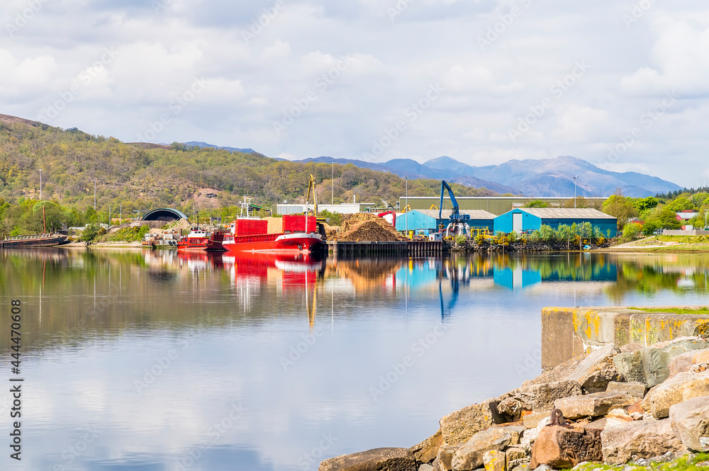 Reflections of vessels moored on Loch Eil viewed from Corpach adjacent to Fort William, Scotland on a summers day
