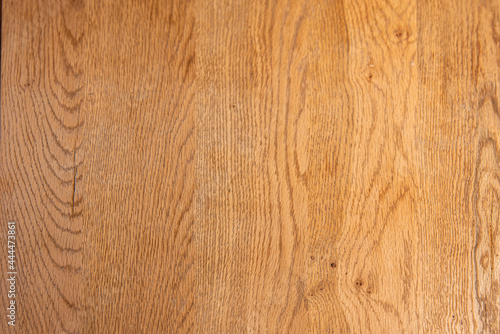 Oak wood table top with beautiful veins varnished with transparent product. Wooden background