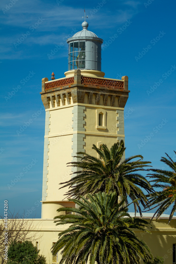 Beautiful Cape Spartel lighthouse on a summer day with a wonderful blue sky and typical North African palm trees. Beautiful Cape Spartel lighthouse on a summer day with a wonderful blue sky and typical North African palm trees.