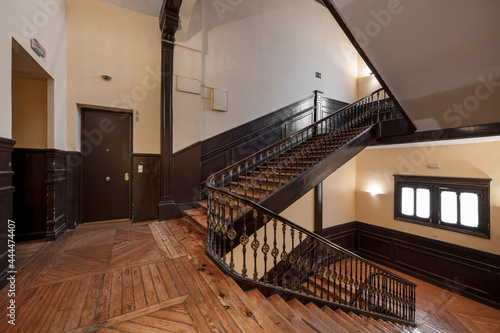 Pine wood stairs and parquet flooring in an old building in the center of a European city © Toyakisfoto.photos