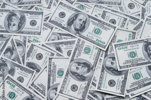 One hundred US dollars banknotes. Cash one hundred dollar bills, 100 dollars, Benjamin Franklin portrait, american currency exchange finance. Pile of hundred US dollars