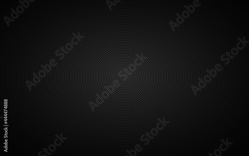 Dark abstract circle background. Black circles on grey background with dark gradient. Simple geometric pattern