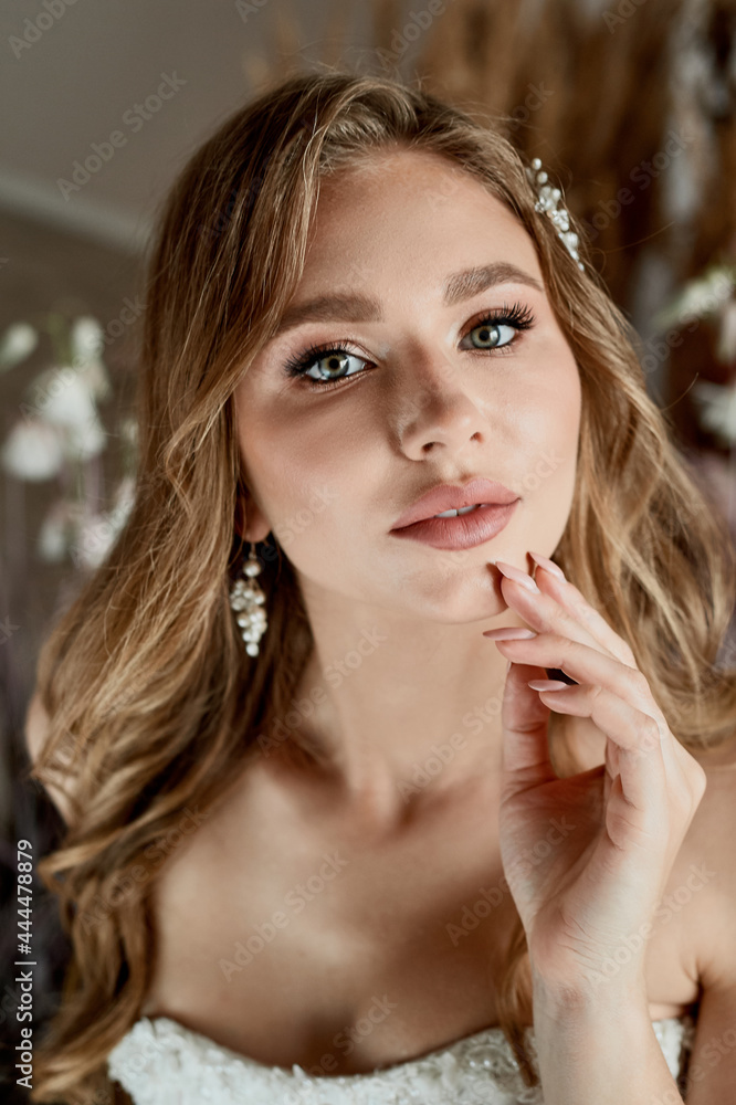 Beautiful bride with pearl earrings jewelry wears pink prom dress. Romantic portrait of Attractive brunette woman with makeup and wedding hair style posing. Beautiful bride with pearl earrings jewelry wears pink prom dress. Romantic portrait of Attractive brunette woman with makeup and wedding hair style posing.