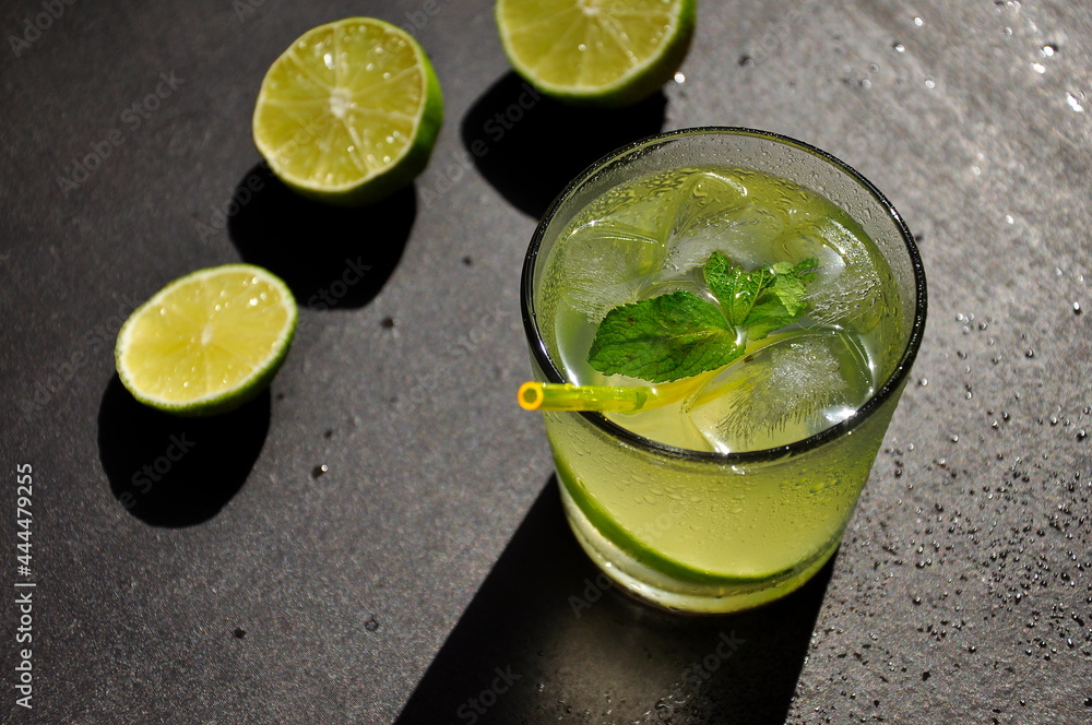 Lemonade in a glass with mint and lime Lemonade in a glass with mint and lime