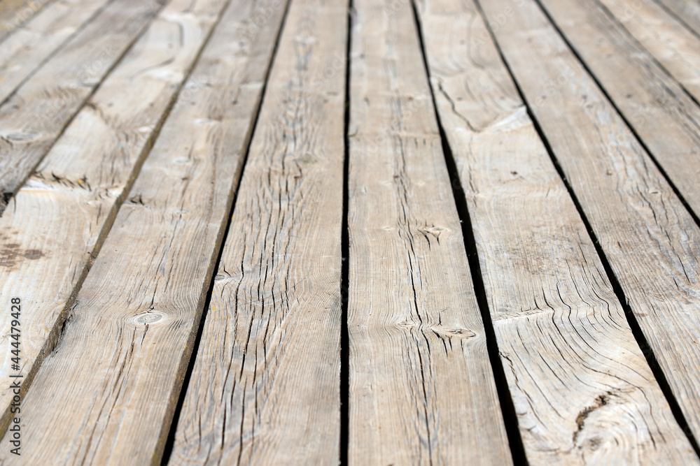 An old wooden pavement. Photo in perspective with selective focus An old wooden pavement. Photo in perspective with selective focus