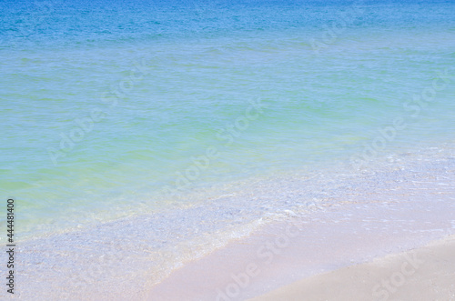 Sandy beach and the sea. Beautiful summer background. Design of photo wallpapers, screensavers, covers.