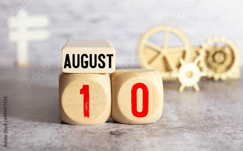 August 10st. Day 10 of month, daily calendar on white table with reflection, with light blue background. photo