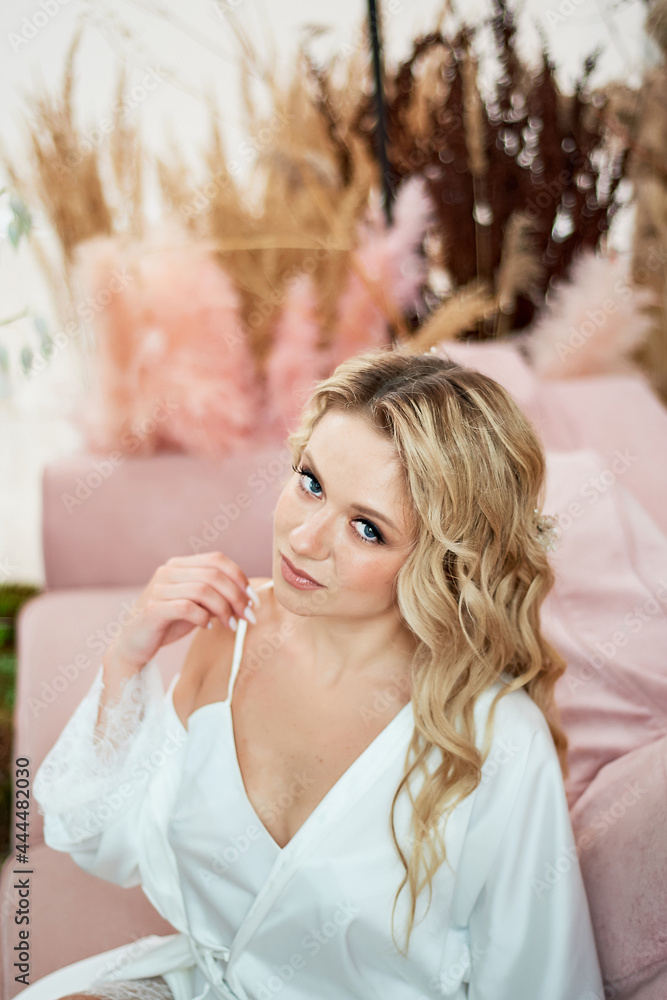Portrait of the bride in white peniou. The morning of the bride. Portrait of the bride in white peniou. The morning of the bride.