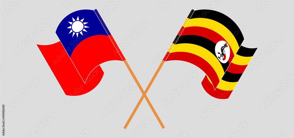 Crossed and waving flags of Taiwan and Uganda