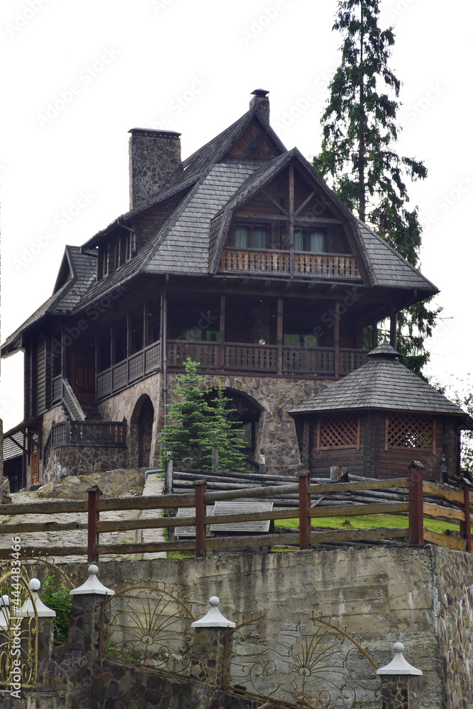 A very old two-story hotel building or just a dwelling on a stone hill A very old two-story hotel building or just a dwelling on a stone hill