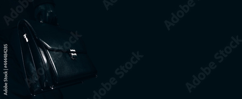  Concept image a business person holding a briefcase.