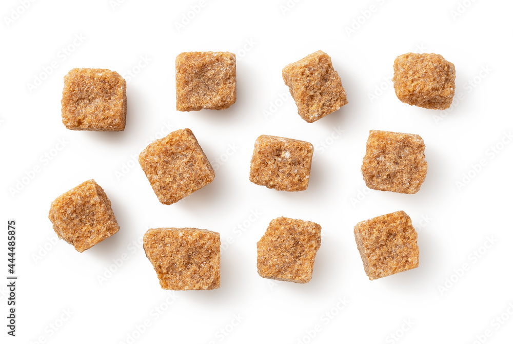 Brown cane sugar cubes placed on a white background. Brown cane sugar cubes placed on a white background.