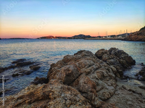 Blue hour in Portisco. Rocky shore. Blue hour. Sunset over rocks in Sardinia