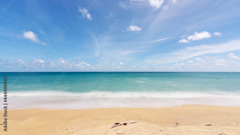 Phuket Thailand Summer background of sandy beach Amazing sea clear blue sky and white clouds Wave crashing on sandy shore