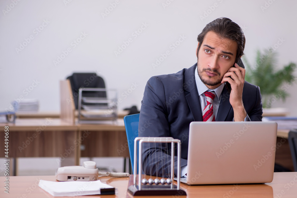 Young man businessman employee sitting in the office Young man businessman employee sitting in the office