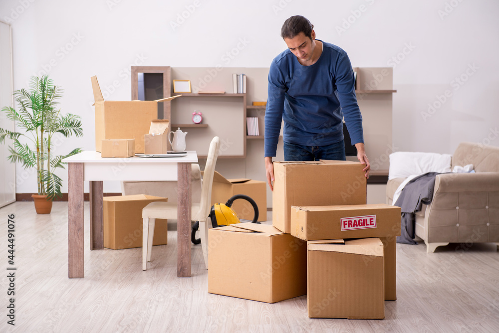 Fototapeta premium Young man moving to new flat