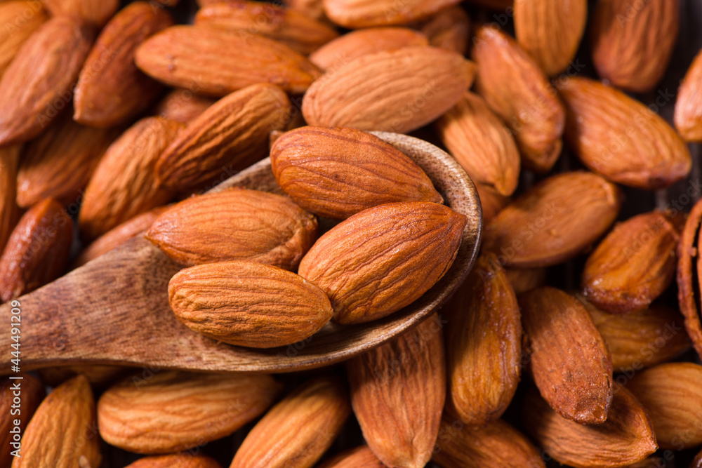 Delicious roasted sweet almonds nuts background Delicious roasted sweet almonds nuts background