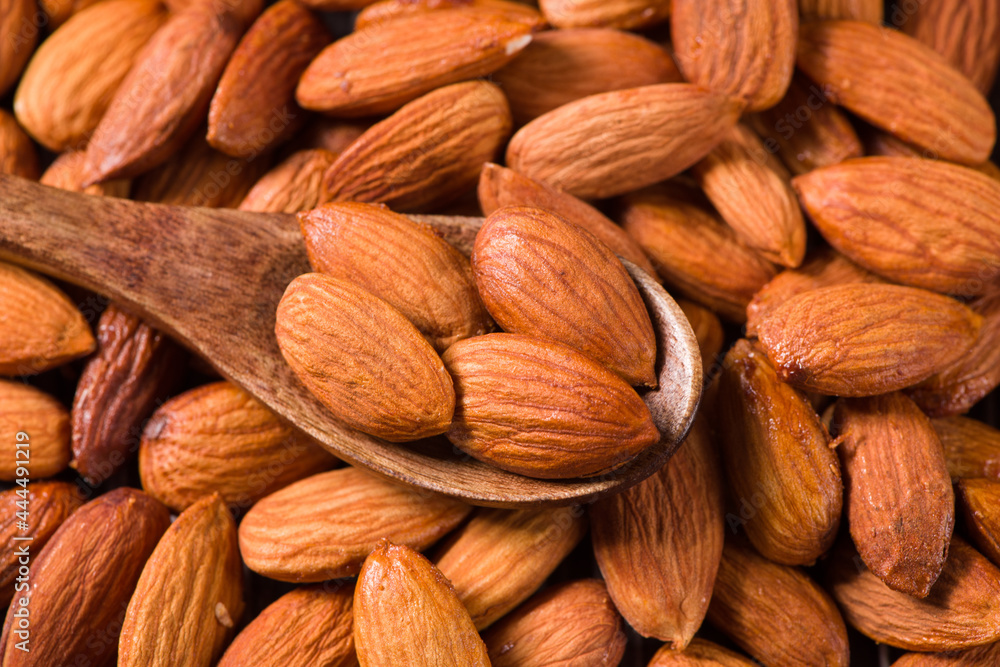 Delicious roasted sweet almonds nuts background Delicious roasted sweet almonds nuts background