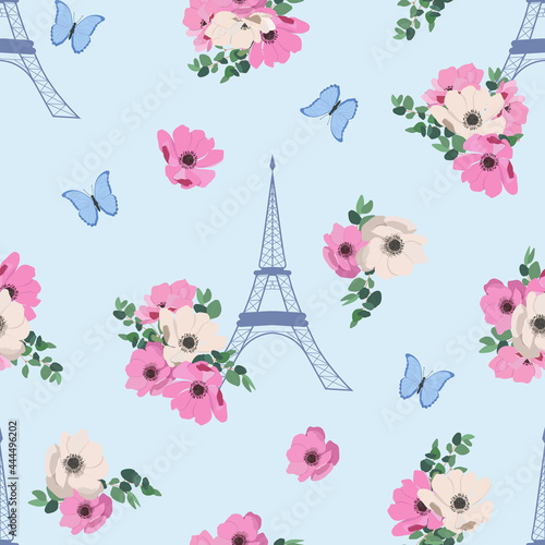 Seamless beautiful vector illustration of a stylized eiffel tower with anemone and butterflies on a blue background.