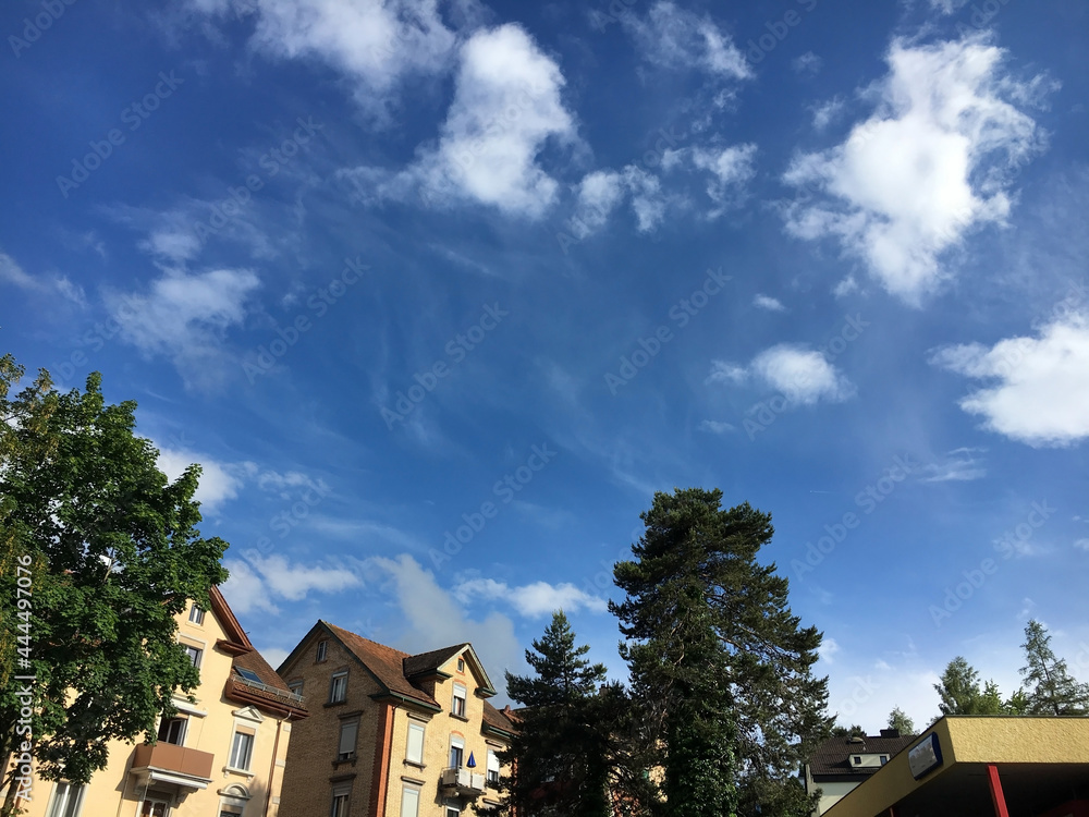 Pure white spring clouds in the clear sky above the Swiss city of St. Gallen, Switzerland (Schweiz) Pure white spring clouds in the clear sky above the Swiss city of St. Gallen, Switzerland (Schweiz)