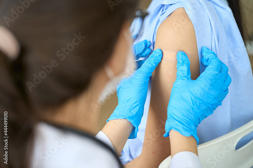 Vaccination concept with doctor injected covid19 vaccine for asian patient woman