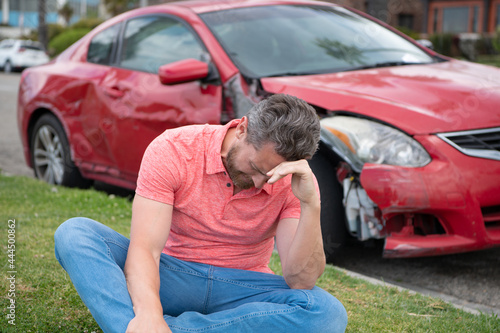 Car insurance. Sad depressed man assistance with car broken on road. © Volodymyr