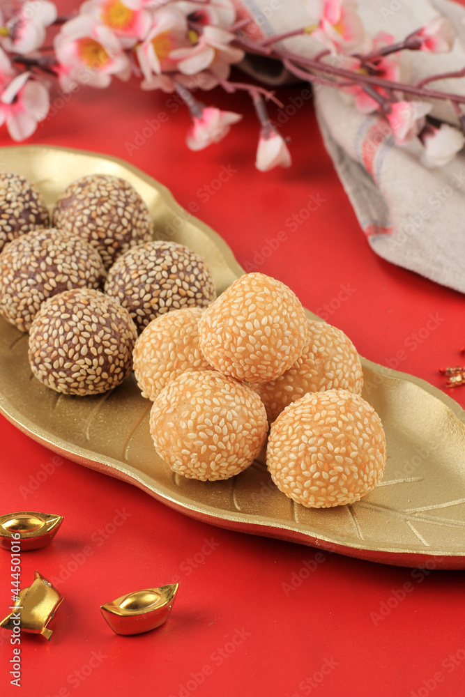 Onde-onde or Glutinous Rice Sesame Seed Ball, Served on Indonesian Traditional Style Bali Plate. Close Up. Popular Indonesian Snack with Chinese Influence. Cap Go Meh Style Onde-onde or Glutinous Rice Sesame Seed Ball, Served on Indonesian Traditional Style Bali Plate. Close Up. Popular Indonesian Snack with Chinese Influence. Cap Go Meh Style