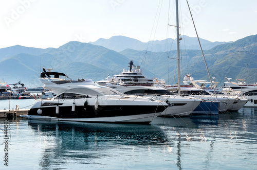 Yachts at the seaport against mountains. photo