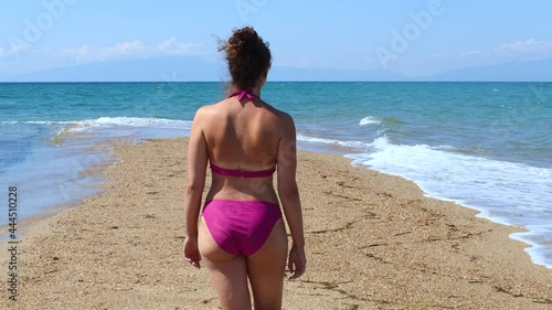Wallpaper Mural Young woman in bikini walking on a sandbank beach  Torontodigital.ca