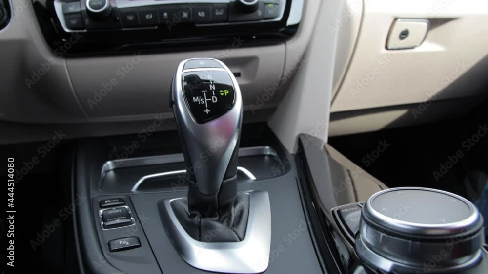 Beige interior. Details inside the car. Gearbox on the automatic transmission. Beige interior. Details inside the car. Gearbox on the automatic transmission.