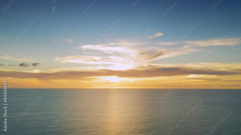 4K Aerial drone top view Beautiful sunset over the tropical beach with clouds In the middle of the sea. Romantic sunset sky over tropical beach holiday summer vacation concept. 4K Aerial drone top view Beautiful sunset over the tropical beach with clouds In the middle of the sea. Romantic sunset sky over tropical beach holiday summer vacation concept.