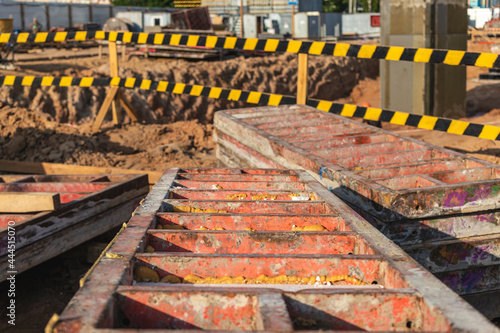 Industrial formwork for concrete foundations. Construction site. Construction equipment. Monolithic work with reinforced concrete.