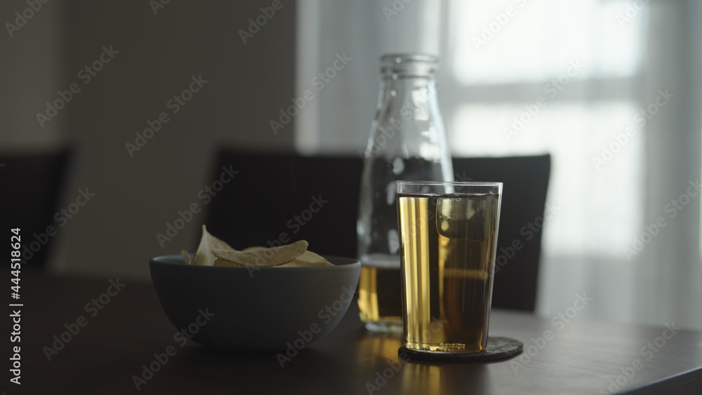 organic potato chips with soft drink on walnut table organic potato chips with soft drink on walnut table