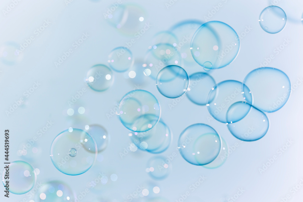 Beautiful Transparent Blue Soap Bubbles as Background.