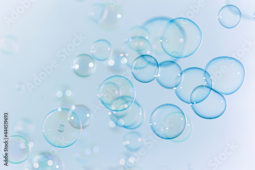 Beautiful Transparent Blue Soap Bubbles as Background.