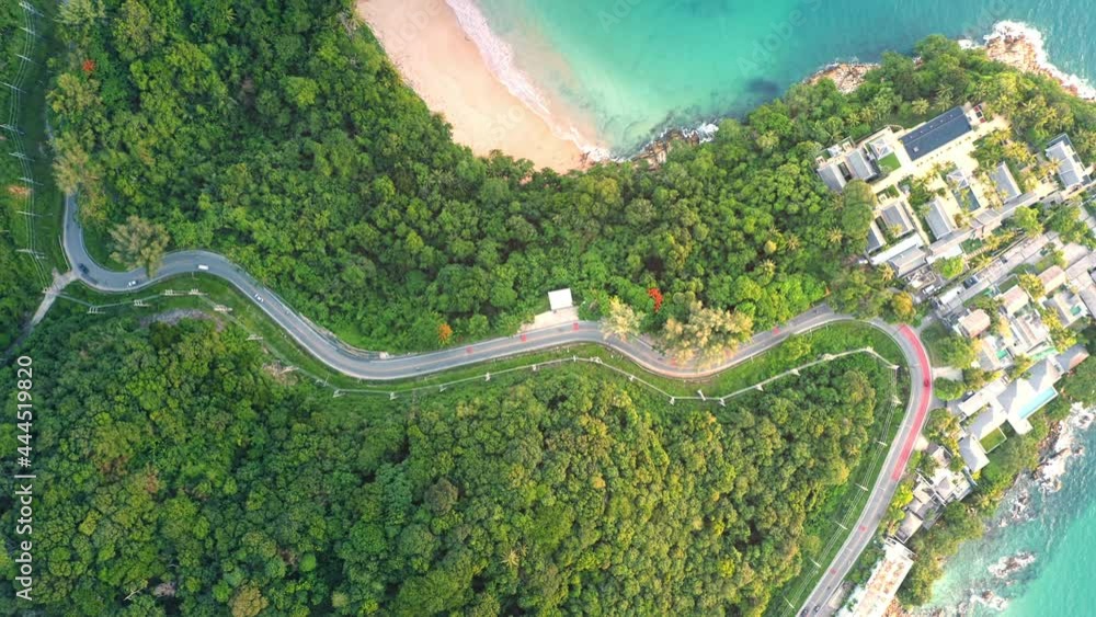 4K Areal drone top down view of curves of coastal road Phuket Thailand beautiful Top view seashore Drone shot over seashore Phuket is famous tourist destination. Top view traffic road around the beach 4K Areal drone top down view of curves of coastal road Phuket Thailand beautiful Top view seashore Drone shot over seashore Phuket is famous tourist destination. Top view traffic road around the beach