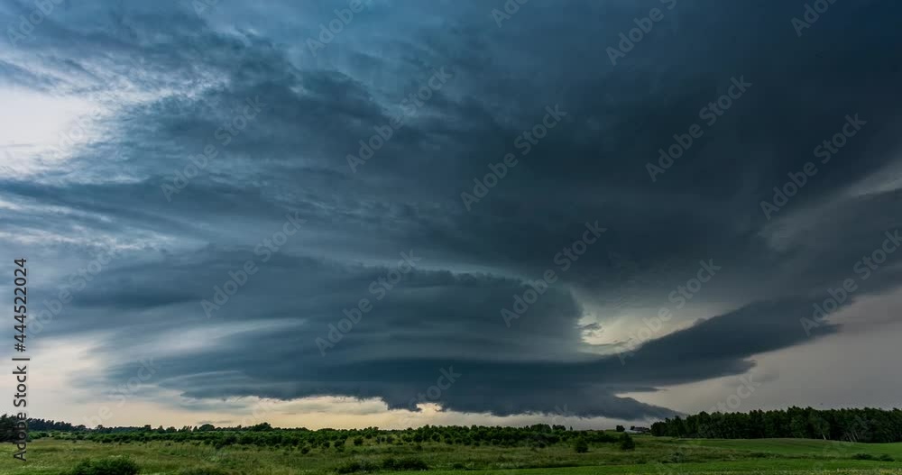 Time lapse of tornado warned supercell storm rolling through the fields in Lithuania, giant rotating wall cloud Time lapse of tornado warned supercell storm rolling through the fields in Lithuania, giant rotating wall cloud