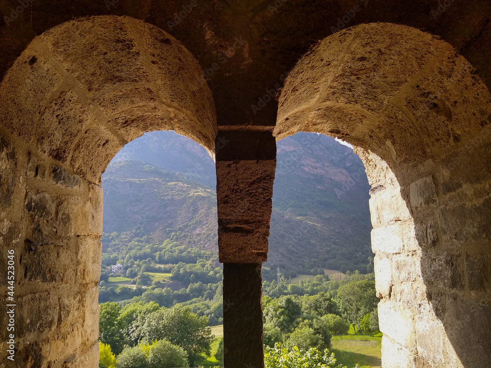 UNESCO World Heritage.
First Romanesque church of Sant Joan in the village of Boí. (11-12 century). Landscape view from the bell tower. Valley of Boi. Spain.