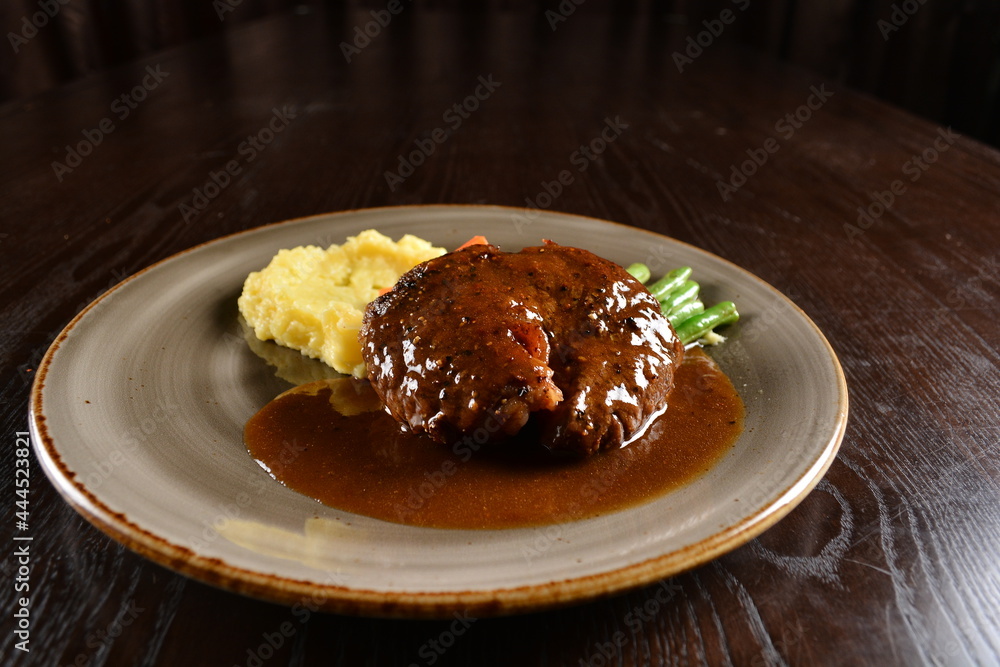 bbq grilled juicy wagyu beef tenderloin sirloin steak in brown black pepper sauce with French fries and vegetables salad dressing western cuisine menu bbq grilled juicy wagyu beef tenderloin sirloin steak in brown black pepper sauce with French fries and vegetables salad dressing western cuisine menu