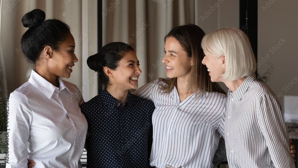 Group of interns and teacher celebrating success, training completion, hiring, career start, talking, hugging, laughing, having fun. Happy united female business team members, company staff portrait Group of interns and teacher celebrating success, training completion, hiring, career start, talking, hugging, laughing, having fun. Happy united female business team members, company staff portrait