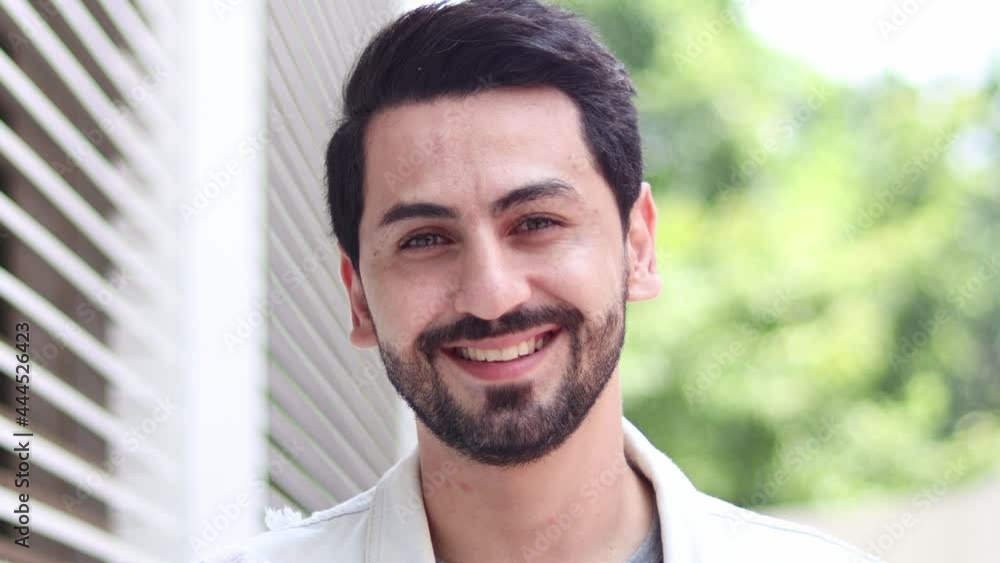 Portrait of a smiling handsome man with a natural background. Concept of lifestyle, achievement. Portrait of a smiling handsome man with a natural background. Concept of lifestyle, achievement.
