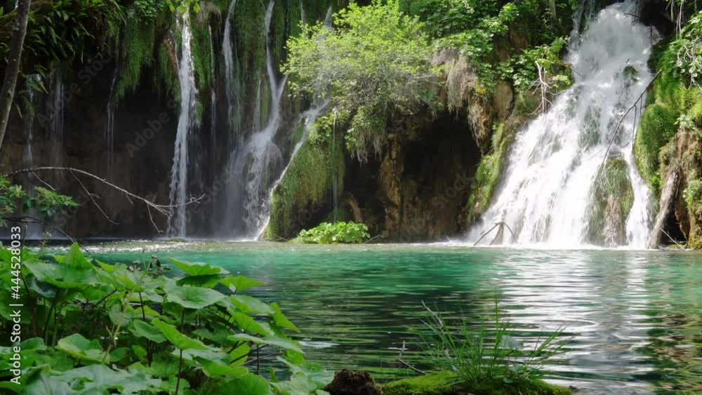 Waterfall in Plitvice Lakes national Park at summer, Croatia. Waterfalls formed by mountain lakes due to melting glaciers Waterfall in Plitvice Lakes national Park at summer, Croatia. Waterfalls formed by mountain lakes due to melting glaciers
