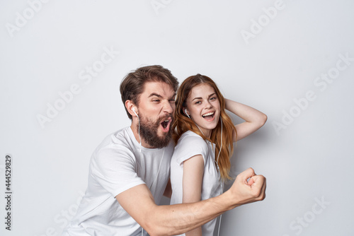 cheerful young couple in white t-shirts best friendship fun