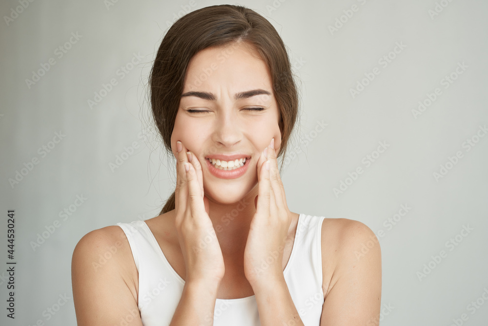woman holds hand on face teeth pain dentistry medicine discomfort woman holds hand on face teeth pain dentistry medicine discomfort